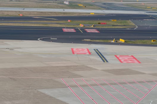 Duesseldorf, Nrw, Germany - March 18, 2015: View of the rolling field of the airport Duesseldorf Lohhausen..Runway and Landing strip with makings