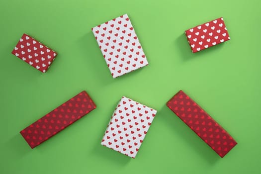 Gift Boxes with little hearts on green cardboards