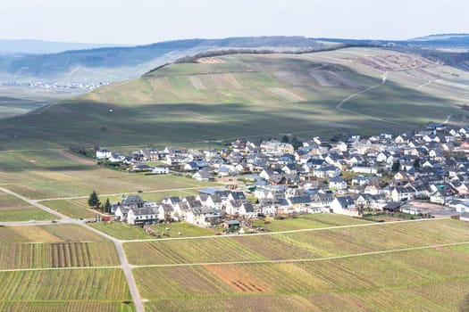 MOSELTAL, GERMANY - MARCH 26, 2016:.Panoramic view over the Moselle valley in the background the vineyards and the River Moselle.