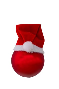 Christmas decorations. Closeup of a red christmas ball with Santa Claus hat isolated on a white background.