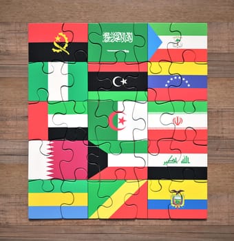 Jigsaw puzzle with the flags of the countries of the Organization of the Petroleum Exporting Countries.