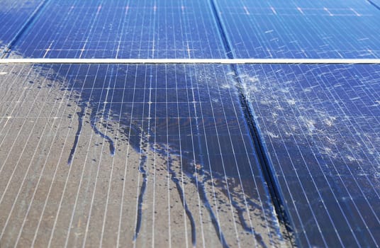 Photovoltaic system contaminated with pollen, cleaning with water, before - after effect.