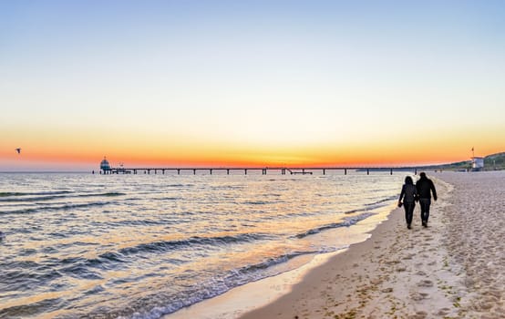 beach, drip castle, pier, bridge Zinnowitz in the sunrise, Baltic Sea island Usedom Germany