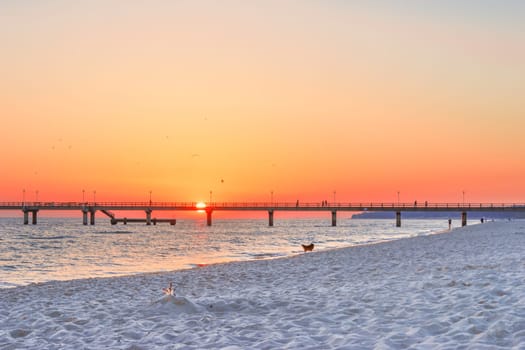 beach, drip castle, pier, bridge Zinnowitz in the sunrise, Baltic Sea island Usedom Germany