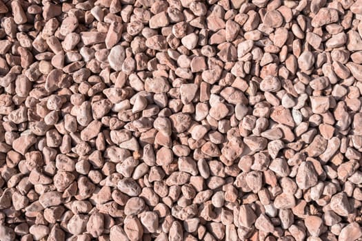 Closeup of little pink pebbles. It can be used for texture and background