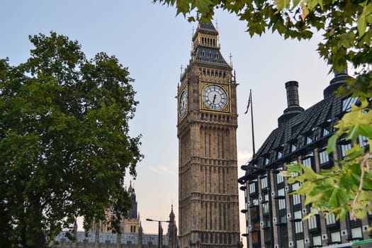 View of Big Ben from behind the trees. United Kingdom.