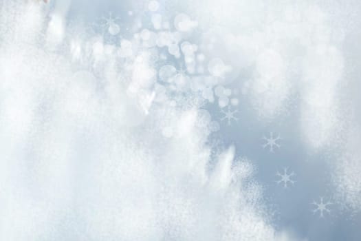 Abstract blurred festive winter christmas or Happy New Year background with shiny blue and white bokeh lighted snow landscape. Space for your design. Card concept.