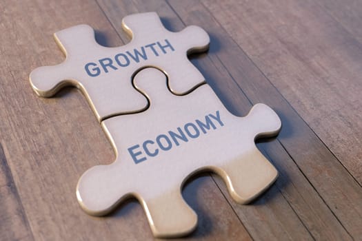 Concept image of economy and growth using parts of a puzzle. Teamwork and good relations in the economy.