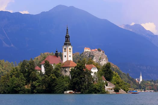 St. Mary's Church in Lake Bled in Slovenia with the hilltop castle in the background