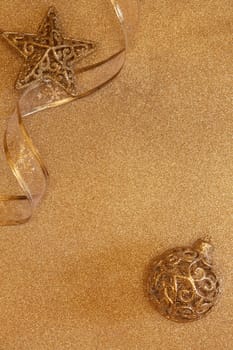 Christmas decorations on a golden background with copy space for text. Top view. Christmas and New Year. Greeting card