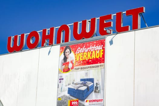 WETZLAR, Germany - March 25, 2018: WOHNWELT logo on a store. WOHNWELT is a German furniture discounter based in WETZLAR, Hessen.
