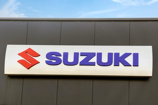 WETZLAR - MARCH 25 2018: Suzuki Motor Corporation logo. Suzuki Motor Corporation is a Japanese multinational corporation,that manufactures automobiles, four-wheel drive vehicles, motorcycles.