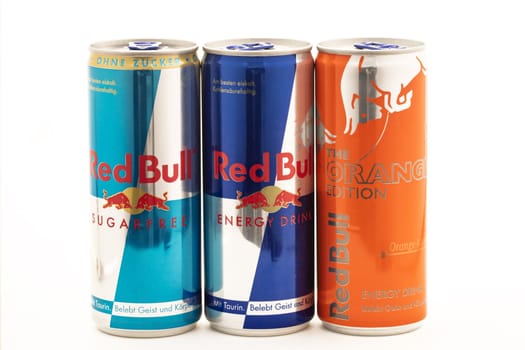 HUETTENBERG, GERMANY - JULY 19 2018: Cans of Red Bull Energy Drinks on white background