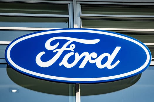 GERMANY, WETZLAR - AUGUST 29, 2017: Logotype of Ford corporation. Ford company logo on dealership building