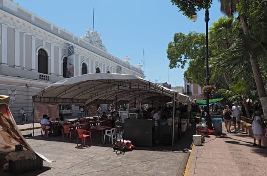 stalls at the street festival in the plaza de la Independencia the merida en domingo merida on sunday.