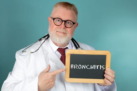 Doctor with eyeglasses holding chalkboard with Bronchitis lettering on blue background