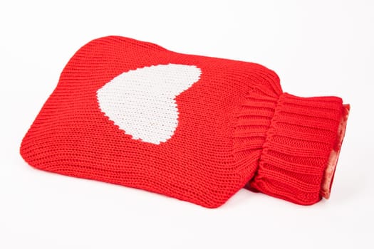 Filled Hot Water Bottle with red heart on white background