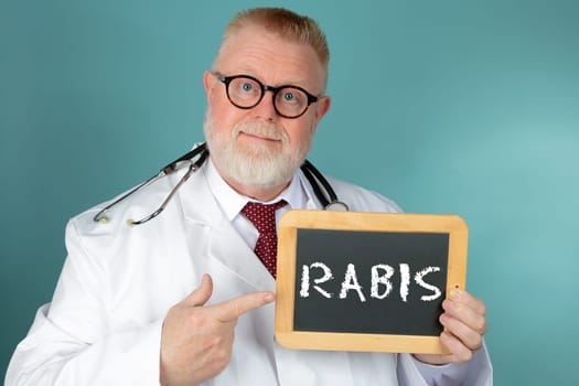 Doctor with eyeglasses holding blank chalkboard on blue background
