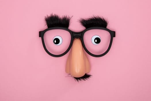 Funny Mask with Eyes and Nose on pink Background