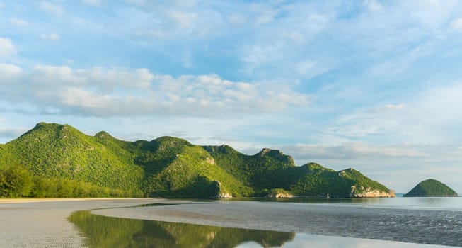 Green Rock or Stone Mountain or Hill and blue sky at Bang Pu Beach Prachuap Khiri Khan Thailand. Landscape or scenery summer season concept