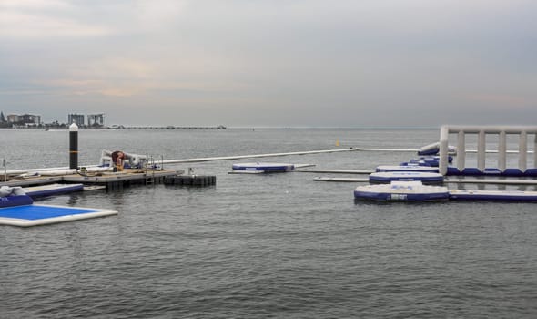View of the inflatable water fun park, called AquaSplash Redcliffe, being constructed on the shores of Pelican Park in the Redcliffe Peninsula, Queensland, Australia
