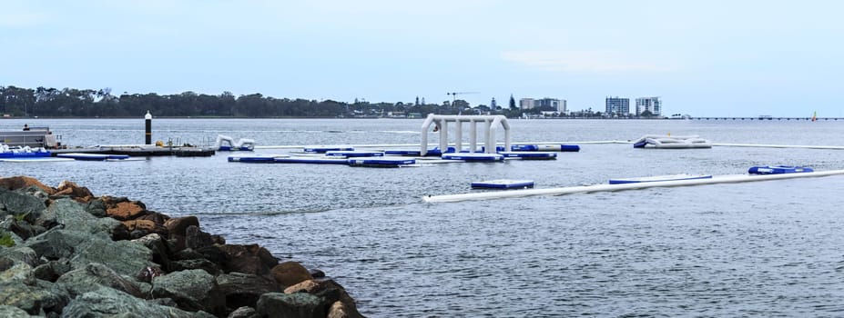 View of the inflatable water fun park, called AquaSplash Redcliffe, being constructed on the shores of Pelican Park in the Redcliffe Peninsula, Queensland, Australia