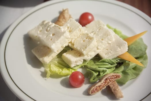 close up plate of cheese arrangement on breakfast table