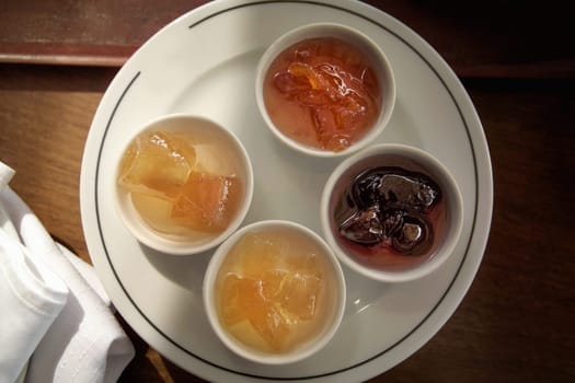 close up variety of jam arrangement on breakfast table