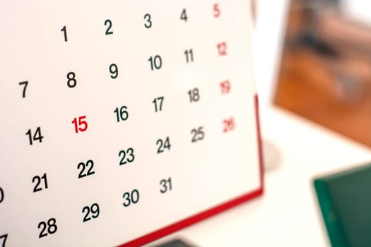 Closeup of numbers on calendar page. Business concept