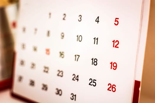 Closeup of numbers on calendar page. Business concept