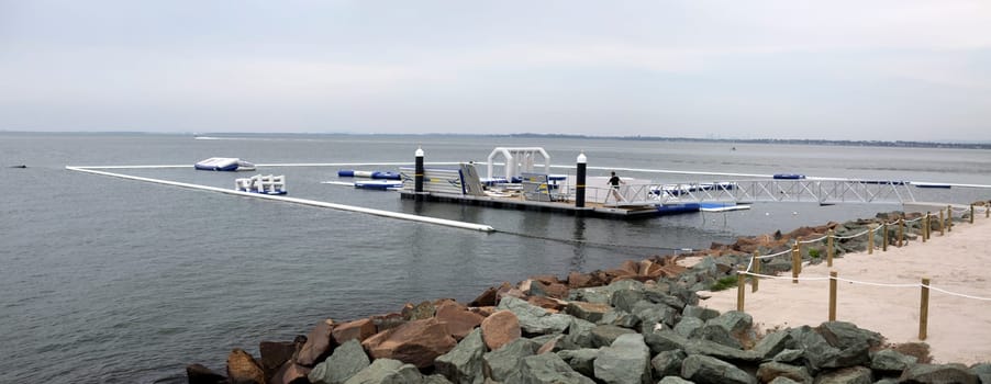 View of the inflatable water fun park, called AquaSplash Redcliffe, being constructed on the shores of Pelican Park in the Redcliffe Peninsula, Queensland, Australia
