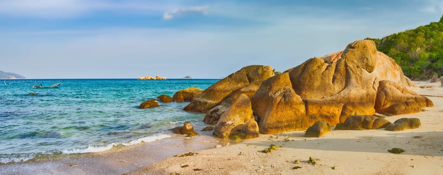 Beautiful white sand beach. Stones on a foreground. Landscape of Vietnam. Panorama