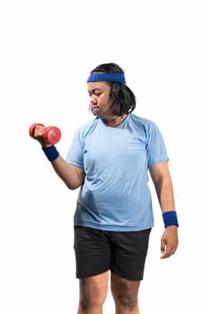 Attractive asian fat man working out with dumbbell posing isolated over white background. Fat man diet concept