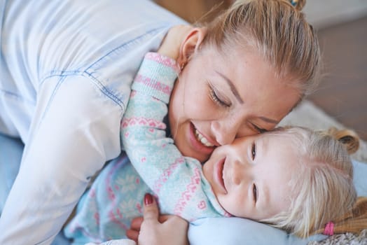 Affectionate female and her daughter in embrace
