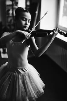 Little ballerina playing the violin