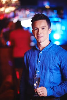 Handsome guy with flute of champagne
