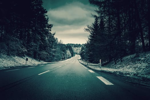 Asphalt road in winter landscape