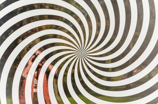 Close-up of a black and white spiral pattern.