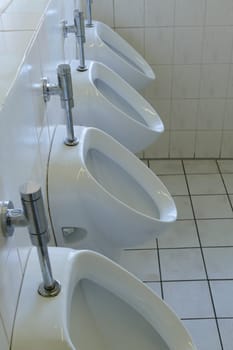 Public urinal in a toilet facility