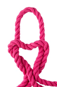 Rope isolated on white. Close-up of node or knot from two pink ropes in the shape of a heart isolated on a white background. Concept valentine, wedding or navy and angler knot.