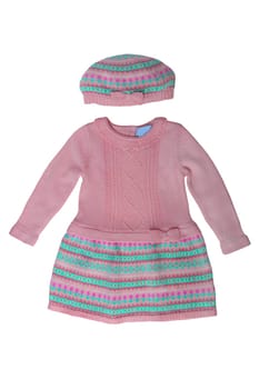 Clothes for children. A beautiful pink bright girl dress and hat with colorful pattern isolated on a white background. Children fashion.