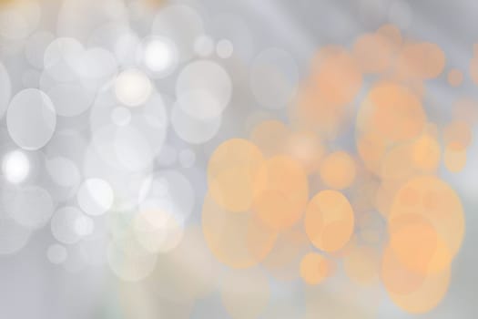 Festive orange silver bright abstract Bokeh with colorful circles. Template for your product display montage. Beautiful texture.