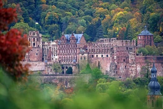 Heidelberg Castle and tower of the Church of the Holy Spirit in autumn