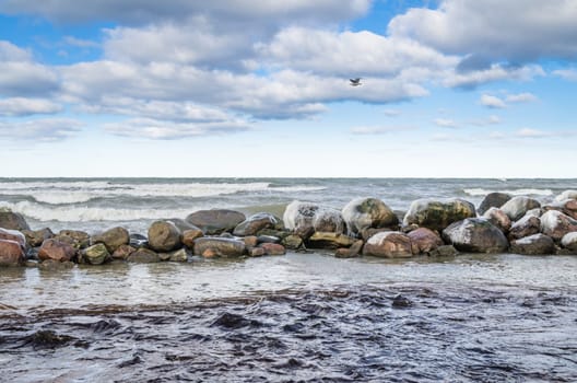 Sea waves breaking on the rocks, seascape