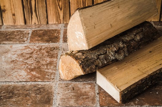 Logs of firewood on the floor, close-up