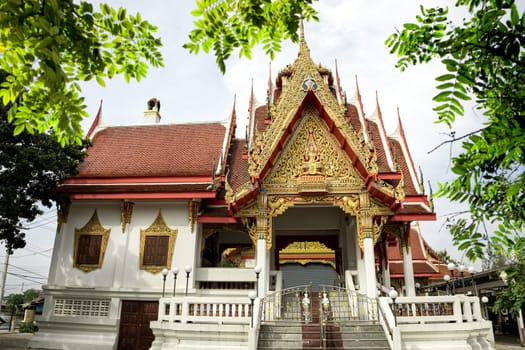 Architectural exterior view of the Buddhist temple in Damnoen Saduak Floating Market near Bangkok, Thailand