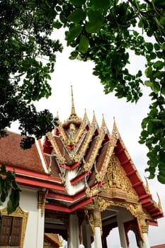 Architectural detail from exterior view of the Buddhist temple in Damnoen Saduak Floating Market near Bangkok, Thailand .