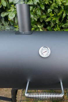 A black barbecue ready for grilling a slow cook pulled pork and ribs