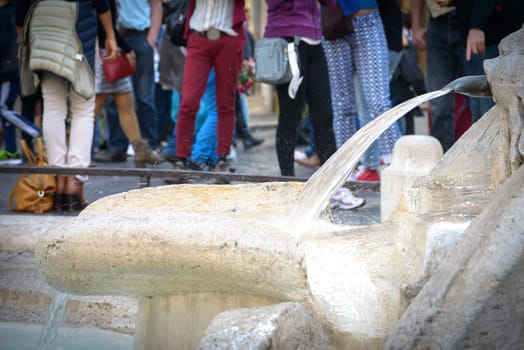 A particular of the amazing fountain called Barcaccia in Navona square in Rome, Italy