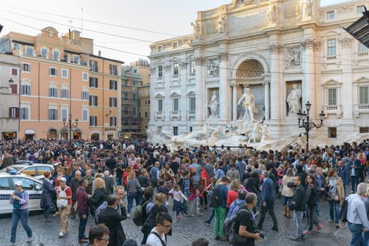 Rome, Italy - November 07, 2015: Tourists in front of Trevi's fountain in Rome